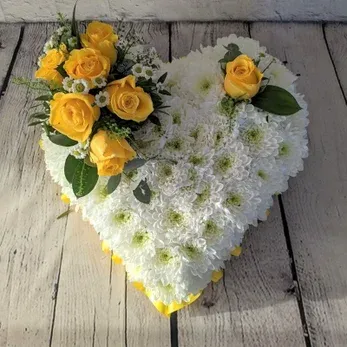White chrysanthemum heart tribute with yellow roses
